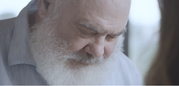 Video of Dr. Andrew Weil holding and feeling the texture of an Ochre Wave fabric swatch