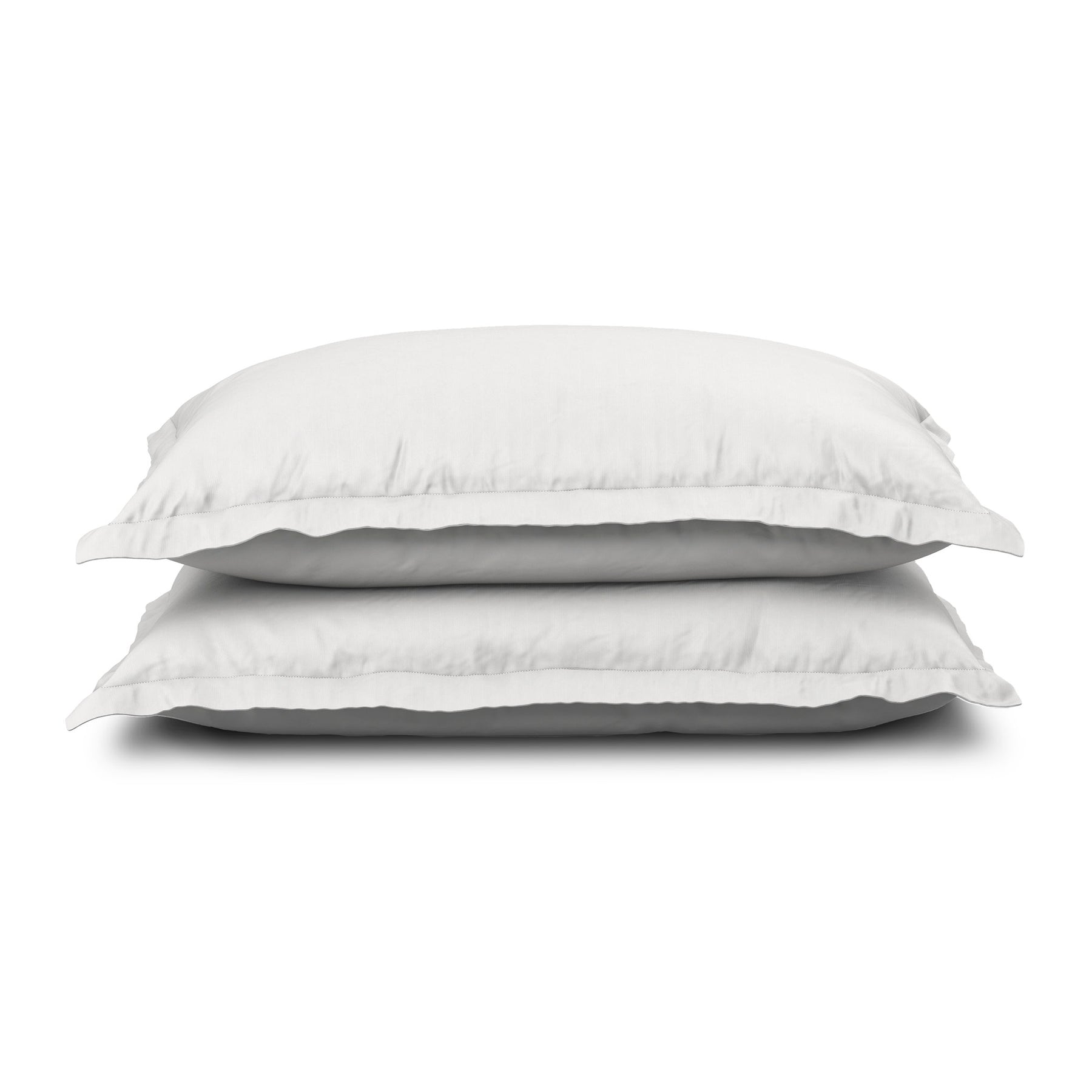 Image of two pillows stacked on top of one another with the White Soft Touch Pillow Shams on them