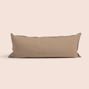 Image of Desert Sand Garment Washed Percale Lumbar Pillow Cover on a lumbar pillow with a light pink background