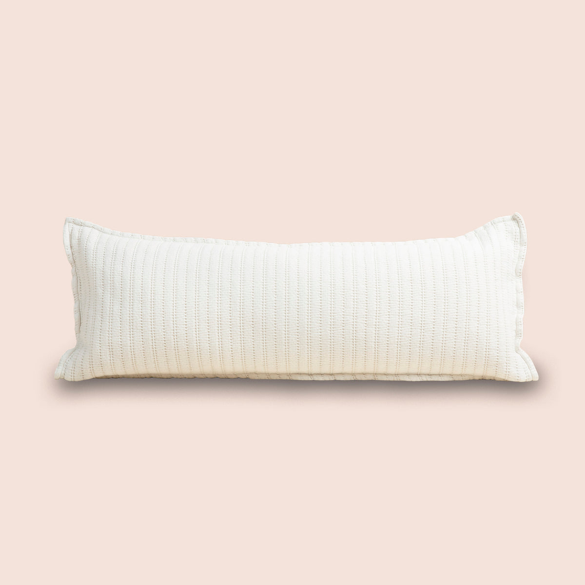 Image of Ecru Ridgeback Lumbar Pillow Cover on a lumbar pillow with a light pink background
