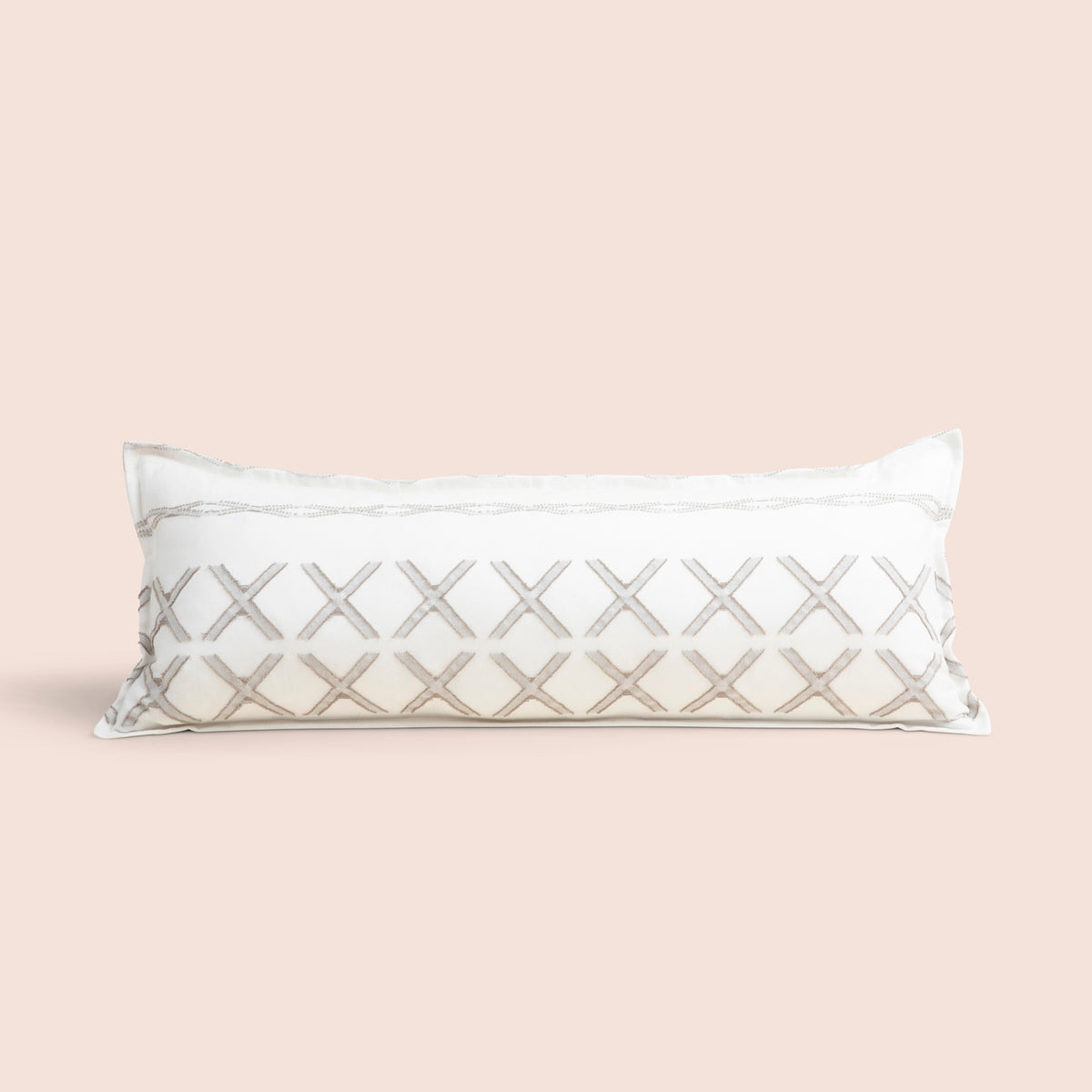 Image of Sonoran Lumbar Pillow Cover on a lumbar pillow with a light pink background
