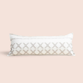 Image of Sonoran Lumbar Pillow Cover on a lumbar pillow with a light pink background