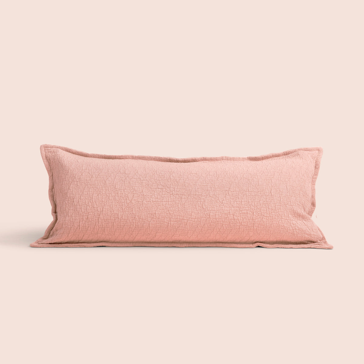 Image of a Pink Sandstone Wave Lumbar Pillow Cover on a lumbar pillow with a light pink background