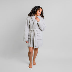 Image of a woman smiling and wearing the gray Sunday Morning Robe