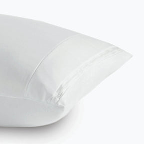 Image of a Pillow Protector on a pillow on a white background showcasing the AirXchange® feature and zipper