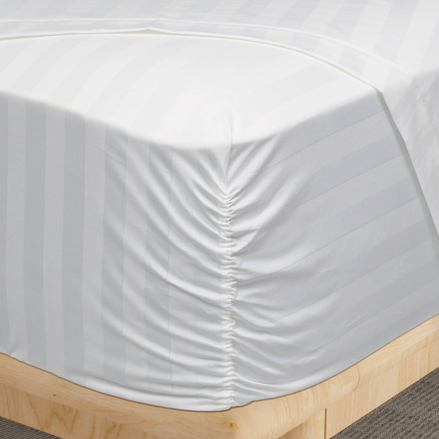 Image of the Luxury Resort Hotel Collection Classic Cotton Sheet Set on a mattress showcasing the Precision-Fit® Corner on the mattress