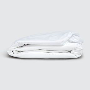 Image of a folded Cooling 5-Sided Mattress Protector on a white background