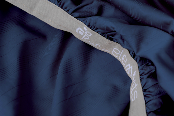 Close-up image of the 1" elastic Precision-Fit® cuff on a Midnight Bamboo fitted sheet