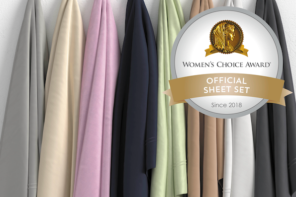 Image of eight hanging bamboo sheets of various colors (dove gray, ivory, lilac, midnight, sage, sand, white, shadow) with the Women's Choice Award logo in the top right corner