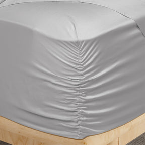 Image of a corner of a Dove Gray Recovery Viscose fitted sheet showcasing the Precision-Fit® Corner