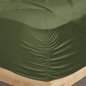 Image of a corner of a Moss Recovery Viscose fitted sheet showcasing the Precision-Fit® Corner