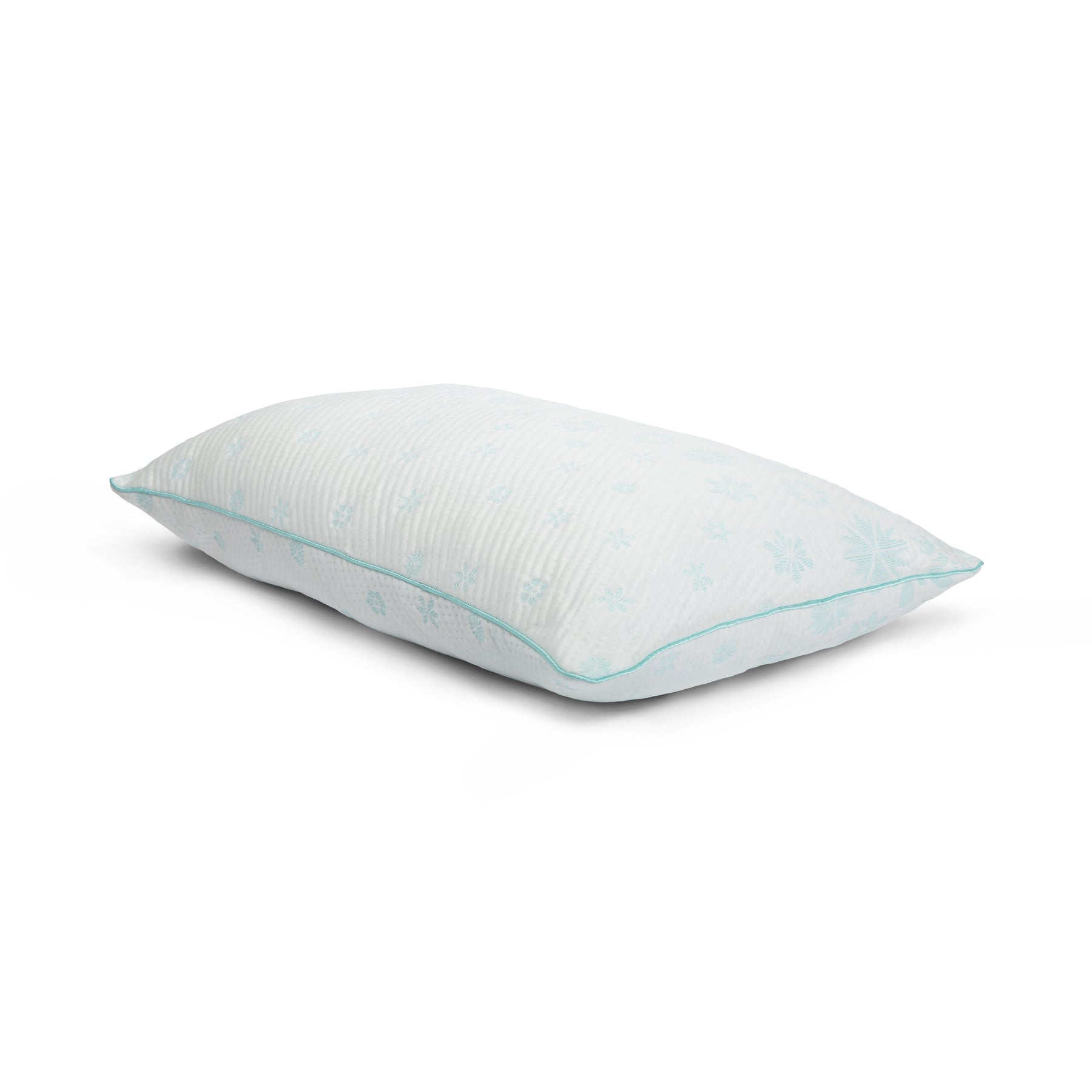 Tabletop image of the Snowflake Foam + Fiber Pillow on a white background. The pillow's cover has a light blue ombre snowflake pattern. 