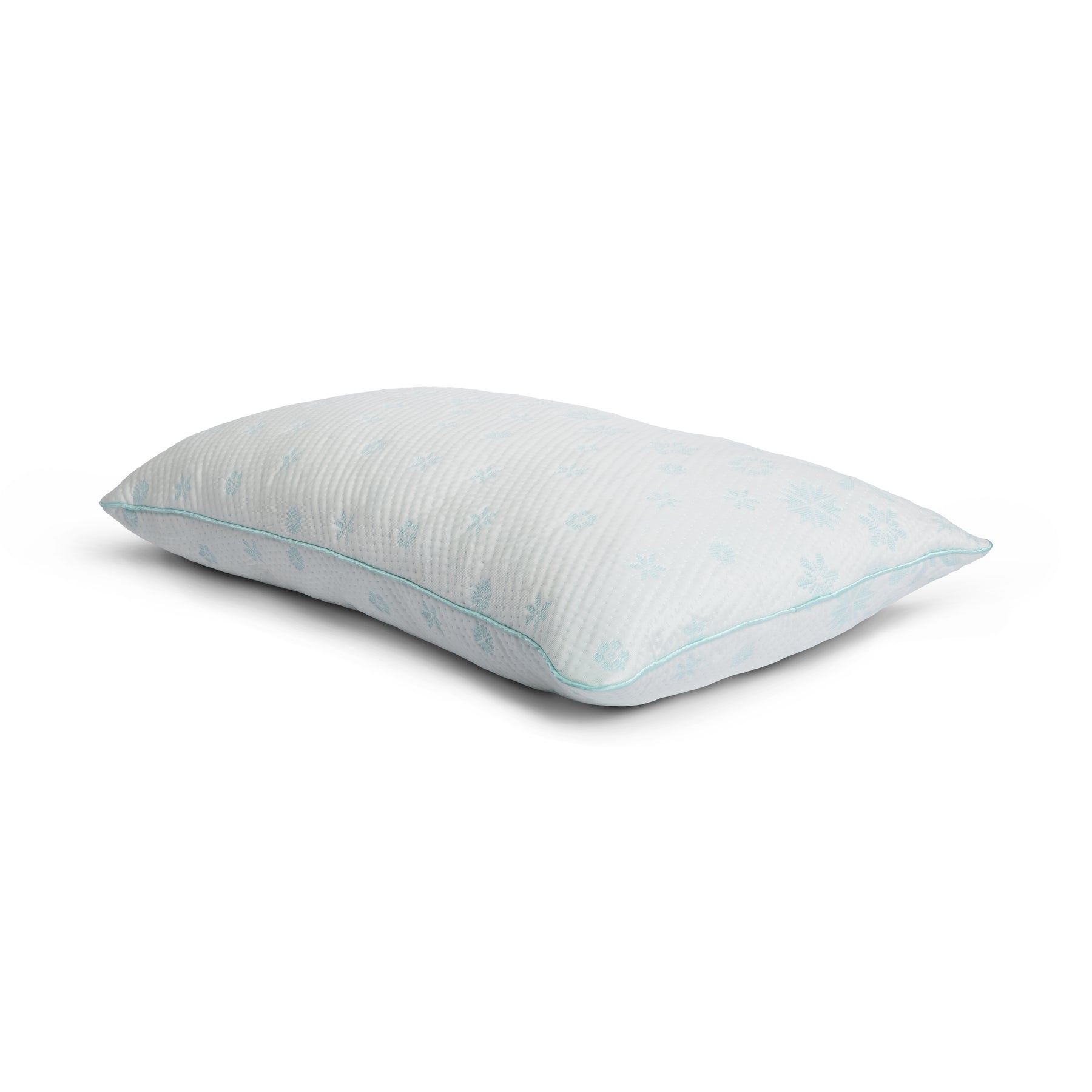 Tabletop image of the Snowflake Foam Pillow on a white background. The pillow's cover has a light blue ombre snowflake pattern. 