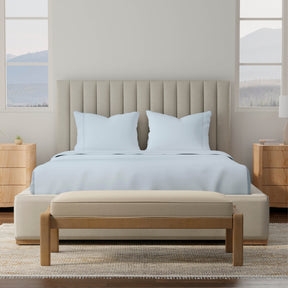 Image of a bedroom with a dressed bed with Light Blue Soft Touch TENCEL™ Modal Sheets 