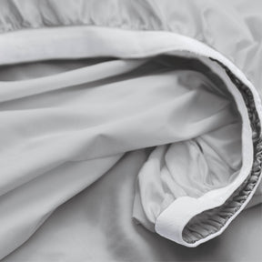 Image showcasing the Precision-Fit® elastic band on the bottom of a Coastal Gray Weightless Cotton fitted sheet