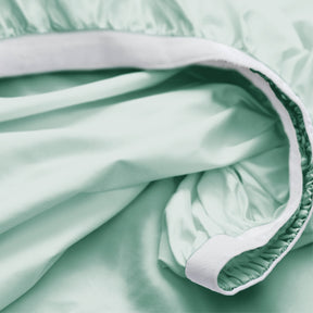 Image showcasing the Precision-Fit® elastic band on the bottom of a Seafoam Weightless Cotton fitted sheet