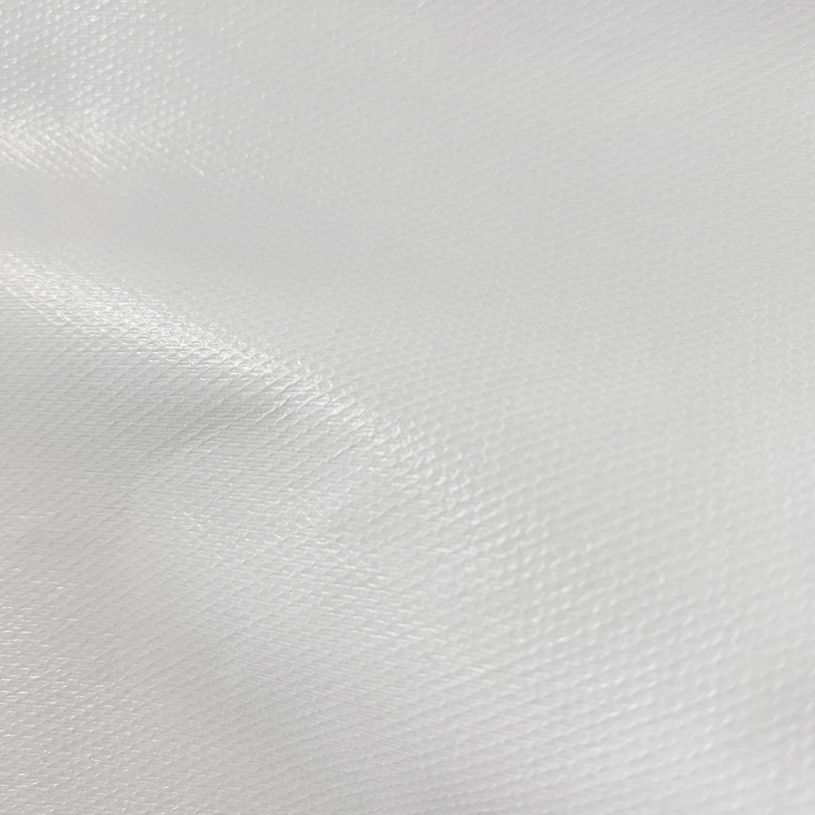 Close-up image of the microdot application on mattress protector fabric