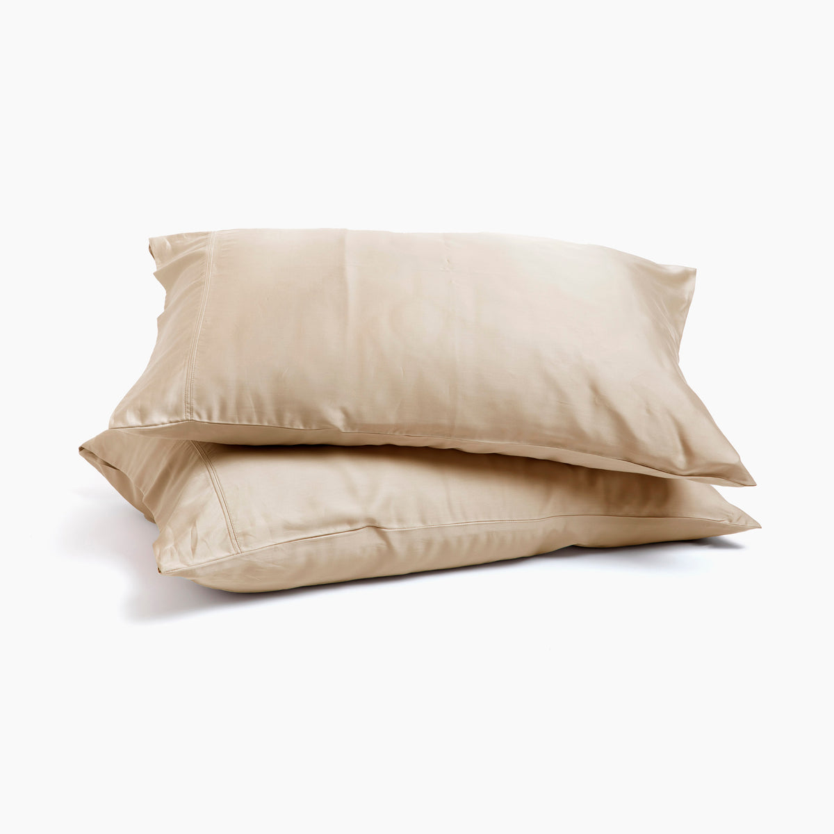 Image of two pillows stacked on top of one another with Ivory Recovery Viscose Pillowcases on them with a white background