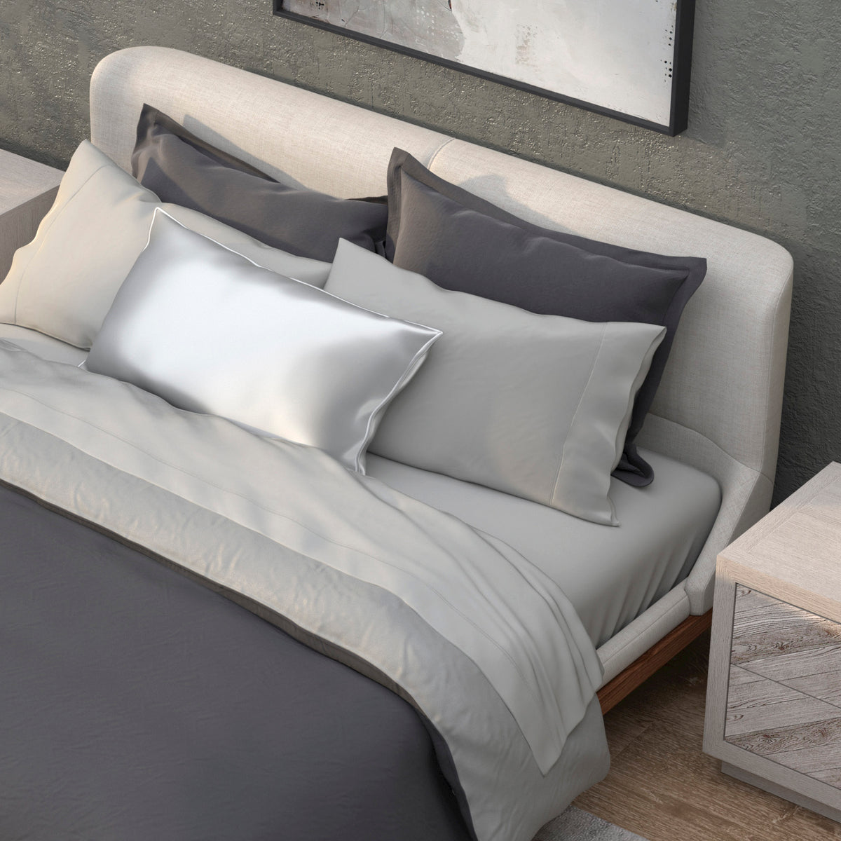 Image of a neatly made bed with a dark gray duvet and the Dove Gray Recovery Viscose Sheet Set and Pillowcases