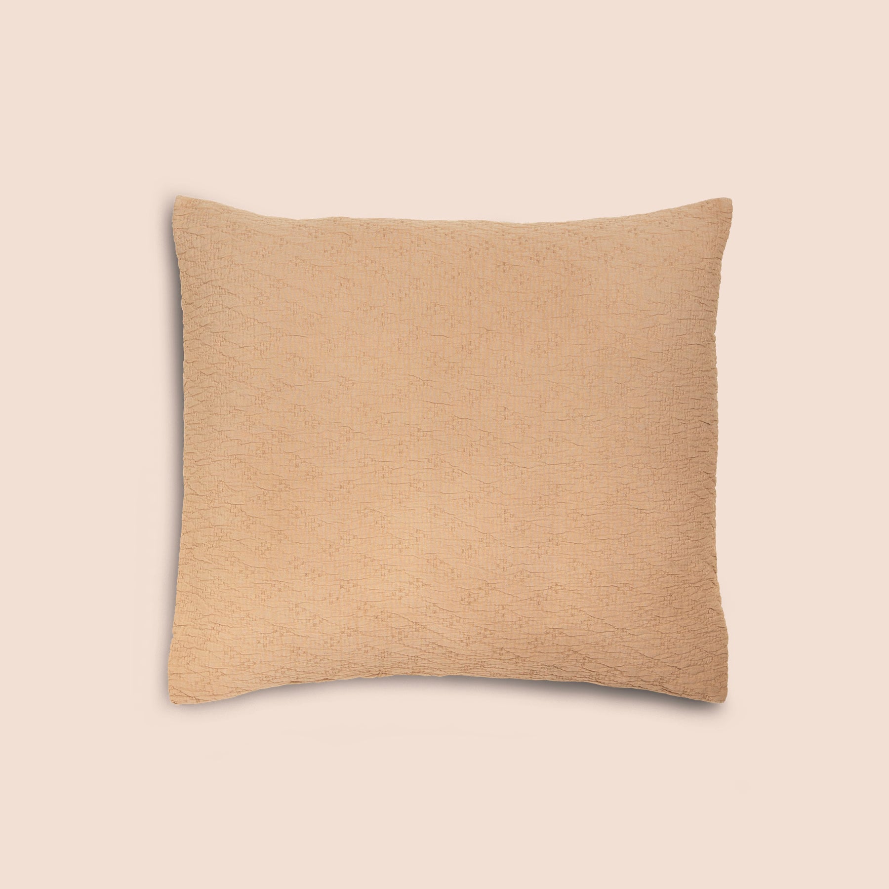 Image of an Ochre Wave Pillow Sham on a Euro pillow with a light pink background