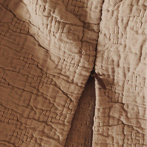 Close-up image of the Ochre Wave Pillow Sham showcasing the zipper feature