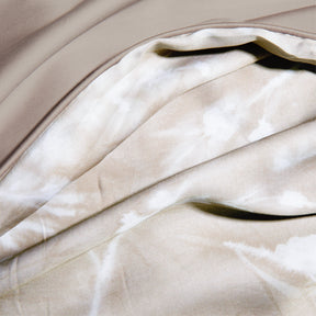 Close-up image of the Floral Oatmeal Pillow Shams + Cooling showcasing both the Floral Oatmeal side and the reversible plain Oatmeal side