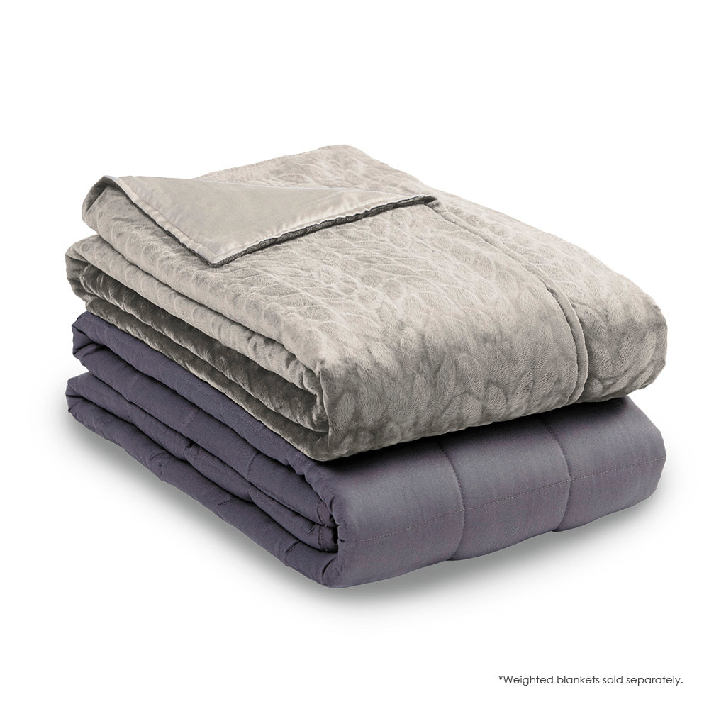 Image of the Dove Gray Weighted Blanket Cover neatly folded on top of a folded Weighted Blanket insert