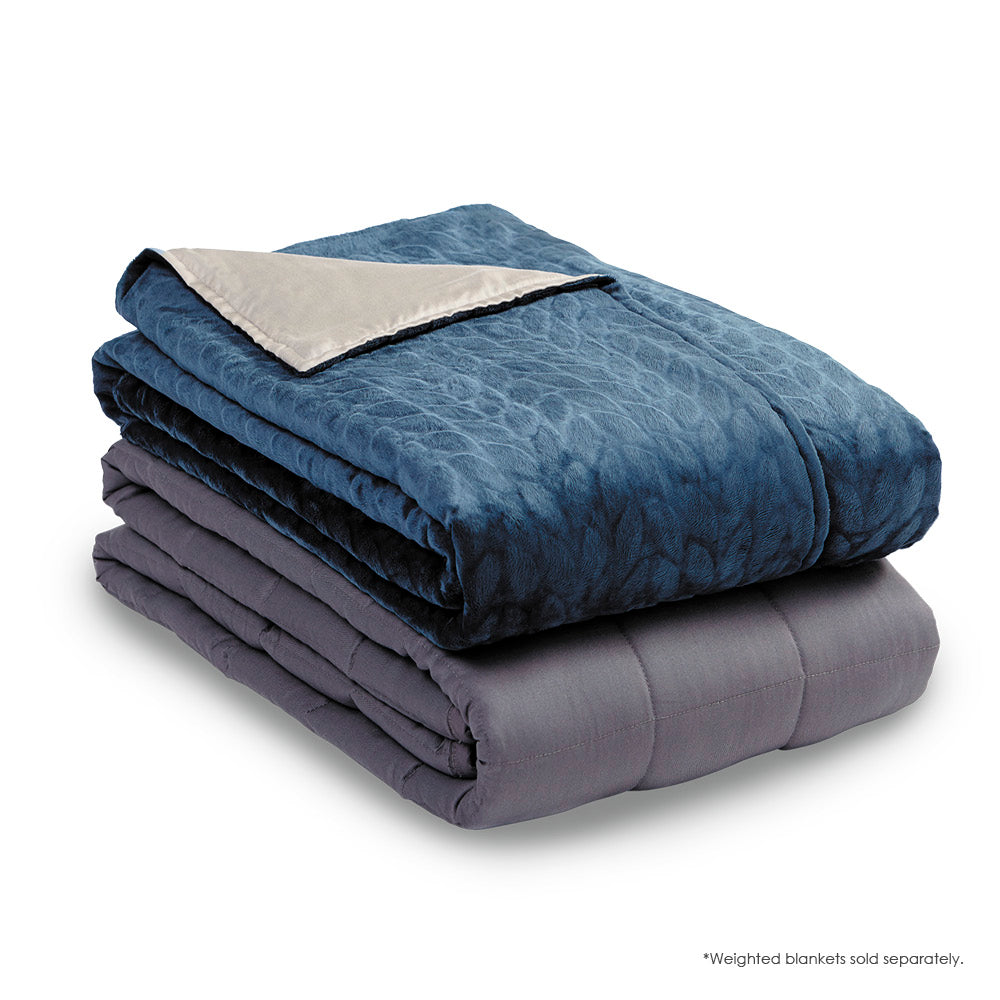 Image of the Midnight Weighted Blanket Cover neatly folded on top of a folded Weighted Blanket insert